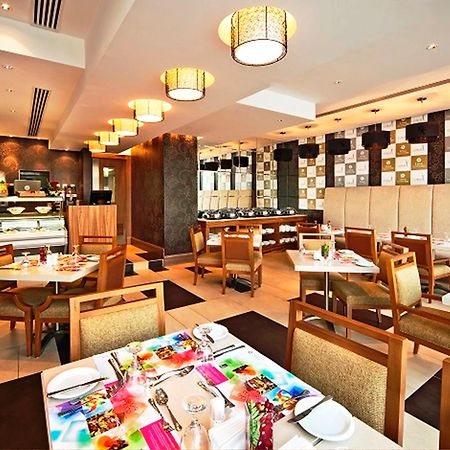Oaks Liwa Executive Suites Abu Dhabi Restaurang bild